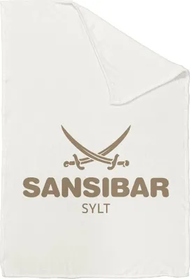 A folded blanket with a logo and text.