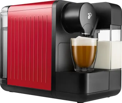 A red and black Tchibo Cafissimo coffee machine is shown with a glass of coffee and a milk container.