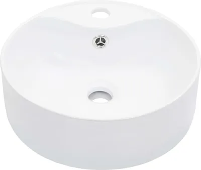 A white ceramic sink with two holes and a drain.