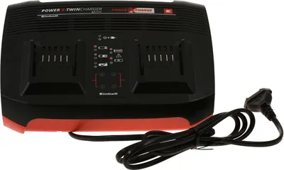 A black and red Einhell Power X-Change Twincharger battery charger with a power cord.