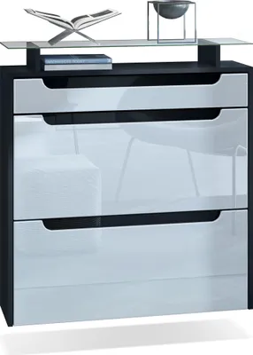 A modern shoe cabinet with a glass shelf on top, displaying decorative items.