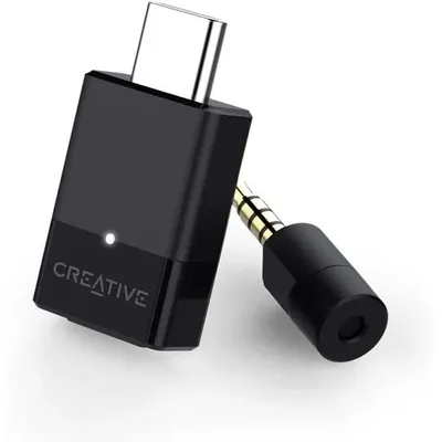 A black Creative BT-W3 Bluetooth 5.0 audio sender with a USB-C connector and a 3.5mm audio jack.