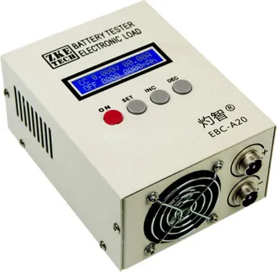 A close-up, slightly angled view of a white electronic battery tester with a fan on the front.