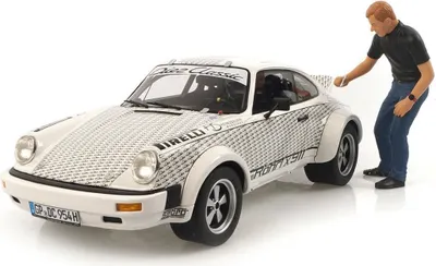 Zdjęcie produktu dla Porsche 911 'Röhrl x 911' + figurka - 1:18 - Schuco