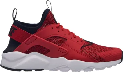 A side view of a red Nike Air Huarache Run Ultra SE sneaker against a white background.