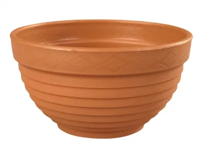 A terracotta-colored plant pot with a ribbed design.