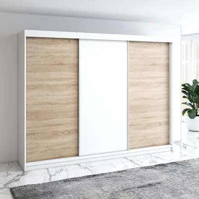 A modern wardrobe with sliding doors in a room setting.