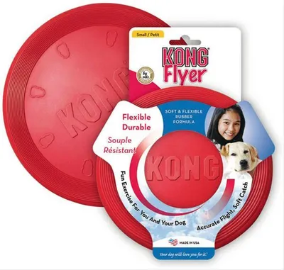 A red KONG Flyer dog toy is shown in its packaging, along with a picture of a girl and a dog.