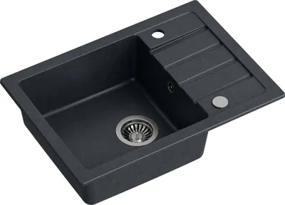 A dark gray granite composite kitchen sink with a single basin and a drainboard.