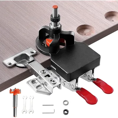 A jig for drilling holes for concealed door hinges is shown on a wooden surface.