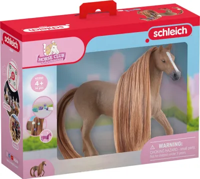 A toy horse in its packaging, with various accessories shown on the side.