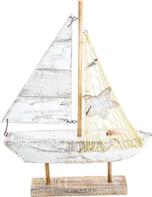 A decorative wooden sailboat on a stand, against a white background.