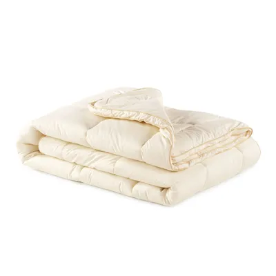 A folded cream-colored comforter is shown against a white background.