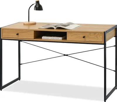 A wooden desk with black metal legs and a black desk lamp.