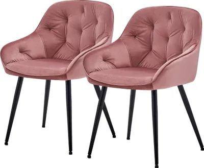 Two pink velvet chairs with black metal legs are shown against a white background.