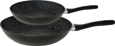 Two black frying pans stacked on a white background.