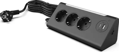 A dark gray power strip with three European-style outlets, two USB ports, and one USB-C port, connected to a black power cord and plug, is shown against a white background.