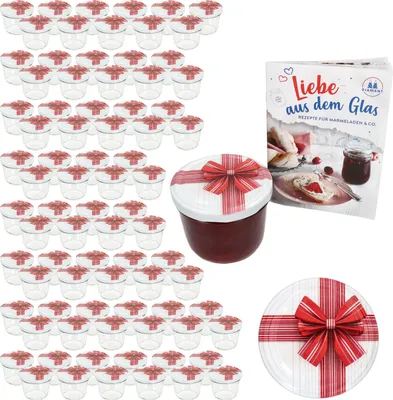 A set of small glass jars with red and white striped lids decorated with red bows, a cookbook, and a decorative plate, all presented as a gift set.
