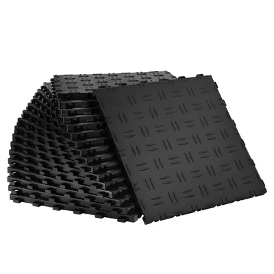 A stack of black interlocking garage floor tiles.