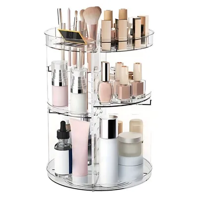 A clear, well-lit studio shot of a rotating makeup organizer filled with various cosmetic products.