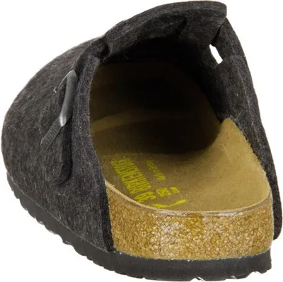 A close-up view of a dark gray Birkenstock clog, showing the cork sole and the felt upper with a buckle.