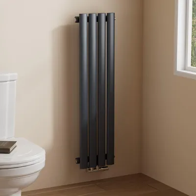 A vertical radiator is shown next to a toilet in a bathroom setting.