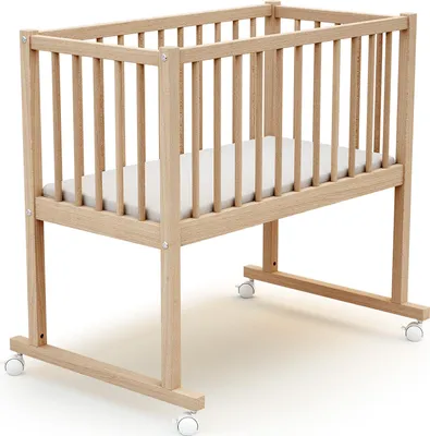 A wooden baby crib with a mattress and wheels, shown on a white background.