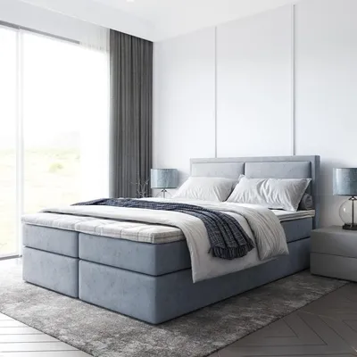 A modern bedroom with a large bed.