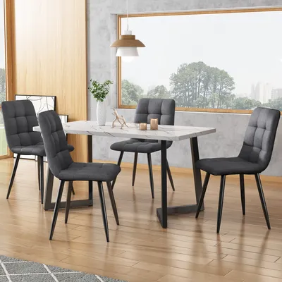 A dining set with a marble-effect table and four upholstered chairs in a modern dining room setting.