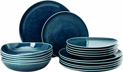 A set of blue ceramic plates and bowls with a textured pattern.