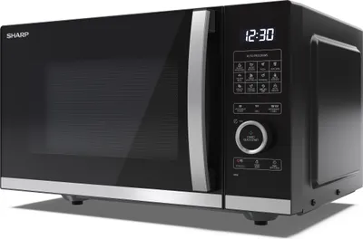 A black Sharp microwave oven is shown from a three-quarter front angle against a light gray background.