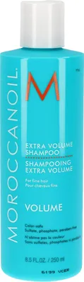 A turquoise bottle of Moroccanoil Extra Volume Shampoo.