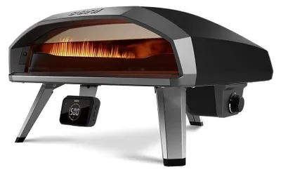 A gas pizza oven with its legs extended, shown from a three-quarter front angle.