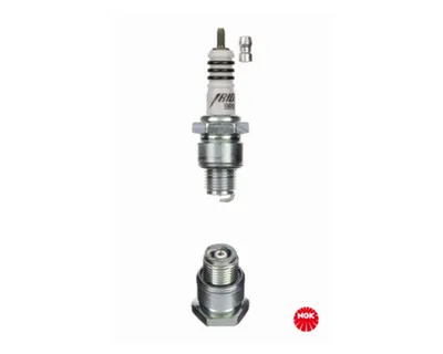 A product shot of a spark plug and its components against a white background.