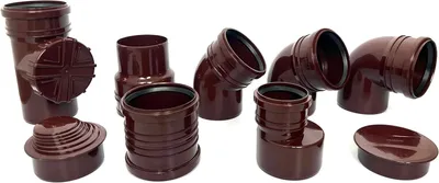 A collection of brown plastic plumbing fittings arranged on a white background.