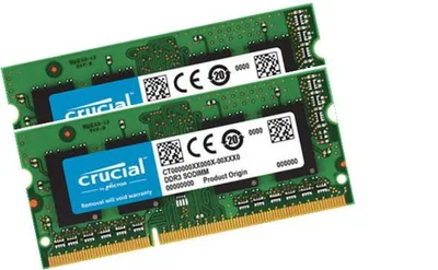 Two Crucial DDR3 SODIMM RAM modules are shown diagonally on a white background.