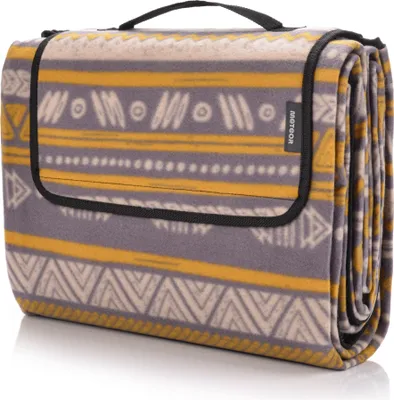 A folded picnic blanket with a geometric pattern.