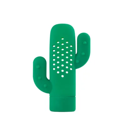 A green cactus-shaped tea infuser is shown against a white background.