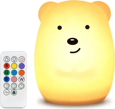 A yellow bear-shaped LED night light and its remote control are shown against a white background.