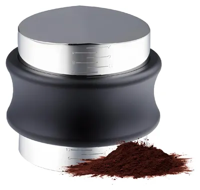 A coffee tamper with measuring lines, next to a pile of coffee grounds.