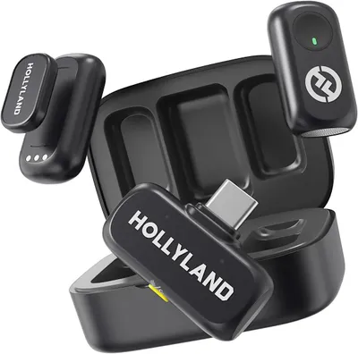 A set of wireless microphones and their charging case are arranged on a white background.