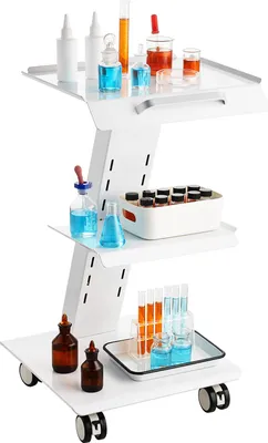 A white three-tiered laboratory cart with various glass beakers, bottles, and test tubes containing colorful liquids.