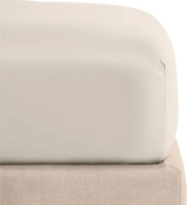 A close-up view of a fitted sheet on a bed.
