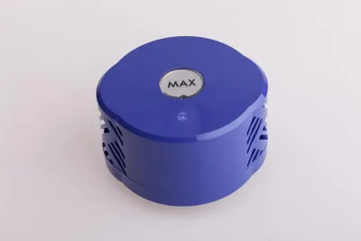 A blue cylindrical device with a silver circular emblem on top, set against a white background.