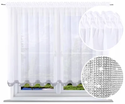 A white sheer curtain with a decorative border is shown hanging on a window.