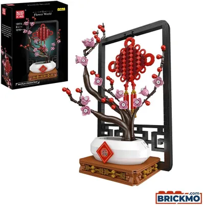 A model of a Chinese plum blossom tree with red lanterns and a decorative frame, presented next to its packaging.