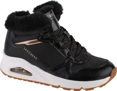 A studio shot of a single black Skechers sneaker with faux fur trim.