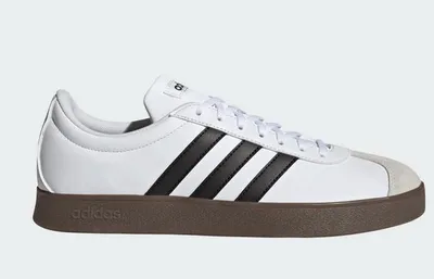 A studio shot of a single Adidas sneaker against a white background.