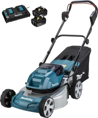 A cordless lawnmower with batteries and a charger.
