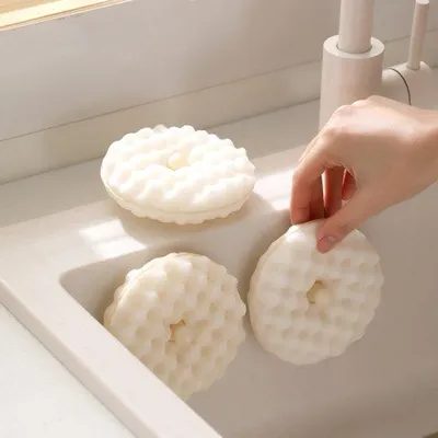 Produktbild von Ein Set aus 4 Haushalts-3D-Abwaschborsteln mit Honigrautstruktur, doppelseitigen Küchentüchern und einem Abwasspuch mit Saugnapf.